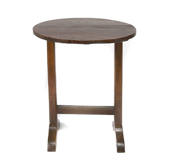 Appraisal: A French Provincial oak and elm circular table height in