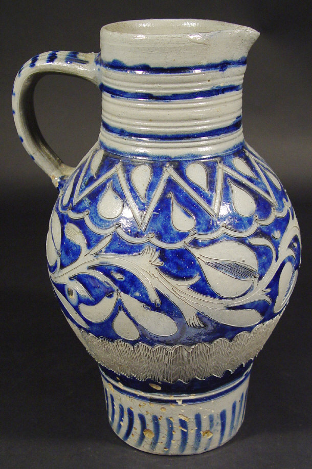 Appraisal: German stoneware jug incised with leaves and decorated with a