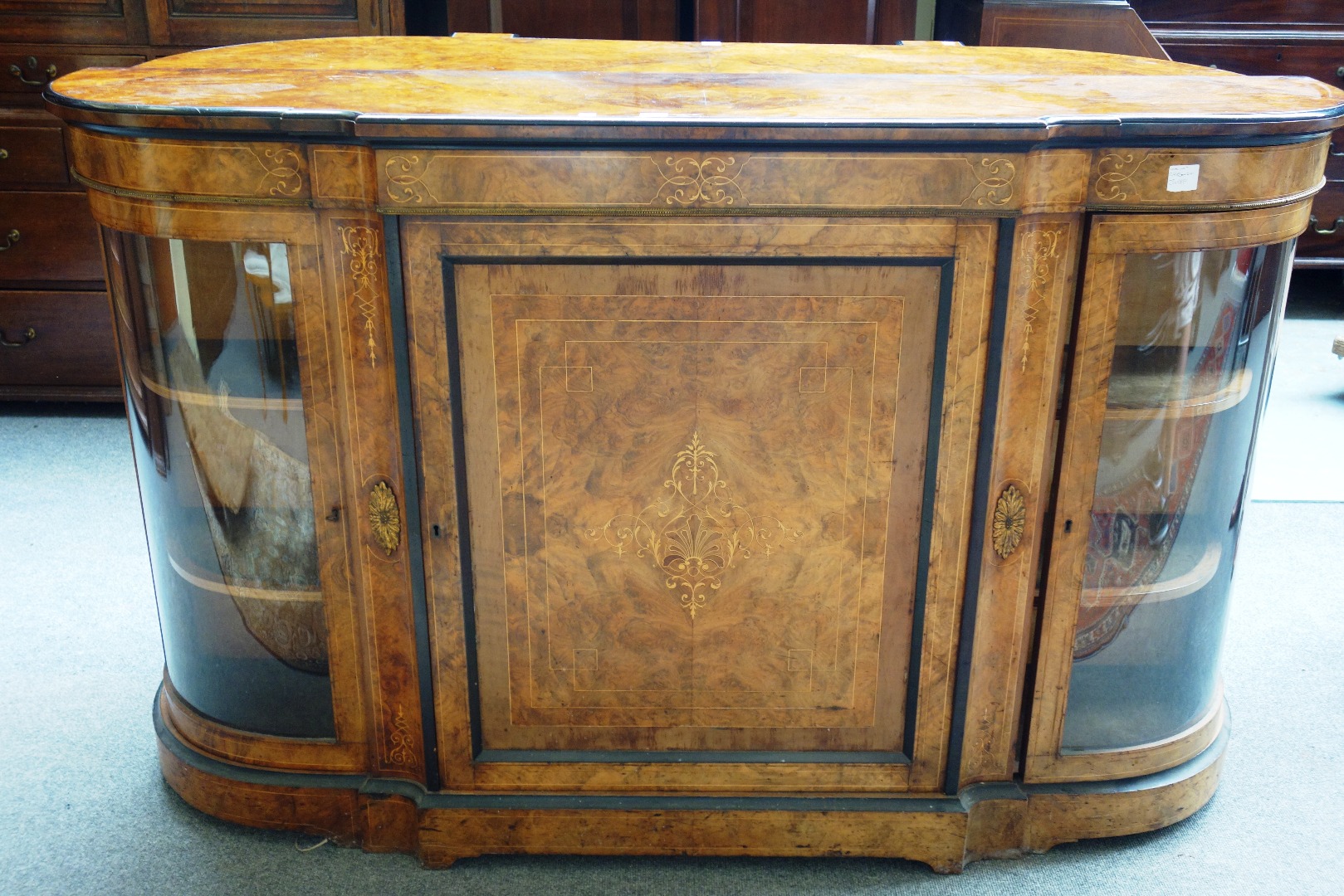 Appraisal: A Victorian gilt metal mounted figured walnut credenza the central