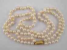 Appraisal: A two row cultured pearl necklace with a yellow metal