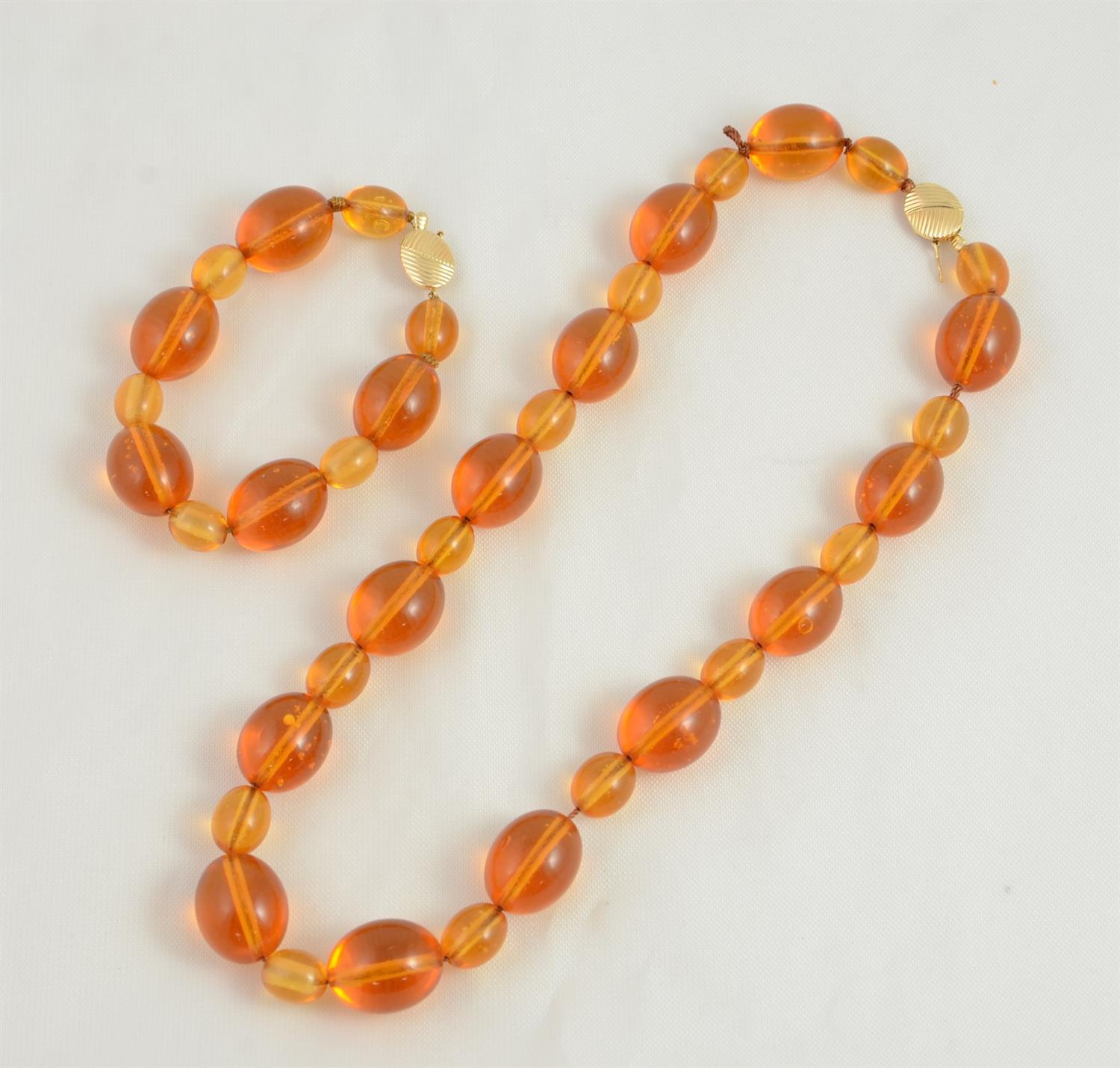 Appraisal: Amber Bead Bracelet and Necklace K YG Clasp Alternating and