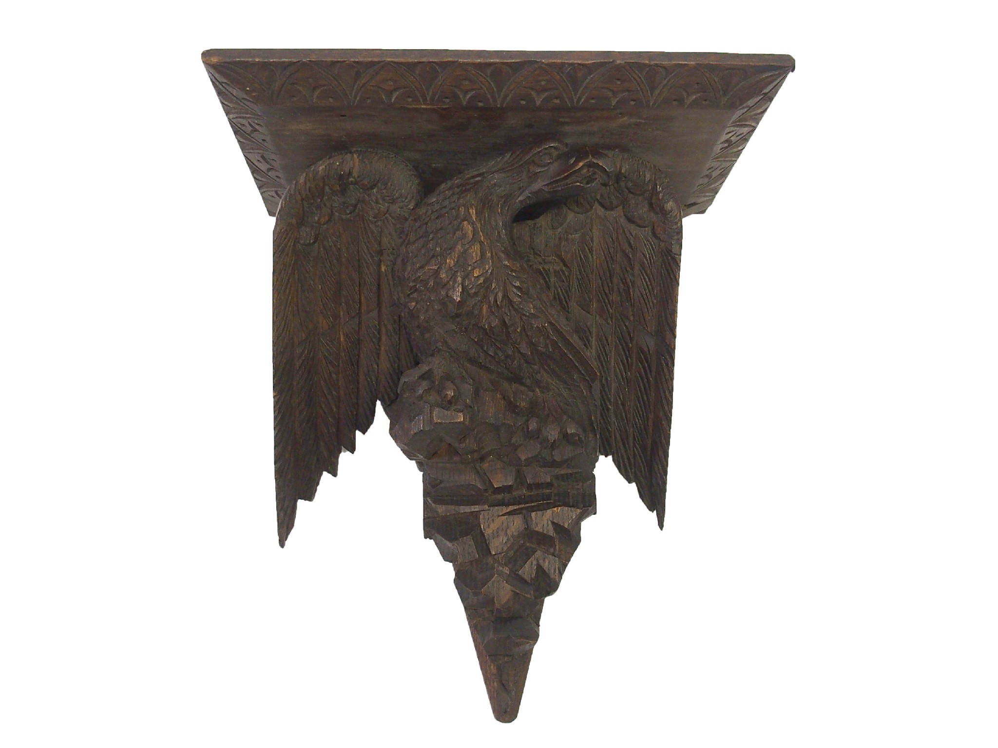 Appraisal: A carved oak wall bracketthe rectangular shelf supported by an