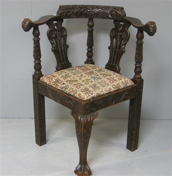 Appraisal: Carved oak corner armchair th century the back rail and