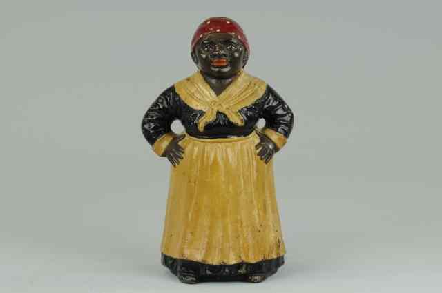 Appraisal: MAMMY DOORSTOP Rare one piece full figured casting depicts popular