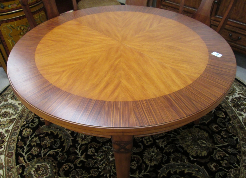 Appraisal: ROUND DINING TABLE WITH TWO LEAVES Tommy Bahama Amaber Isle