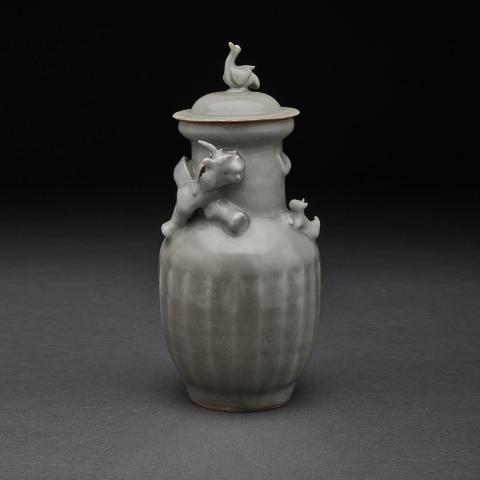 Appraisal: A 'LONGQUAN' CELADON FUNERARY JAR AND COVER SOUTHERN SONG YUAN