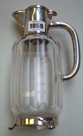 Appraisal: A Victorian silver mounted faceted glass claret jug with a