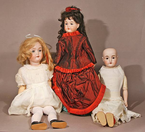 Appraisal: Grouping of bisque headed dolls Lot includes a German doll