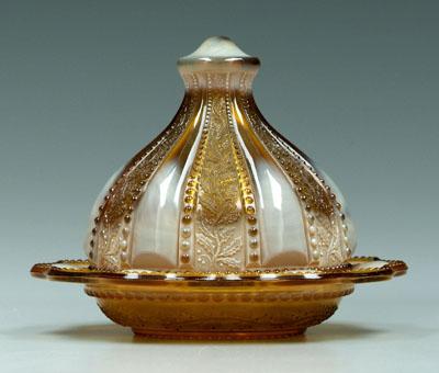 Appraisal: Greentown holly amber butter dish with cover made by Indiana