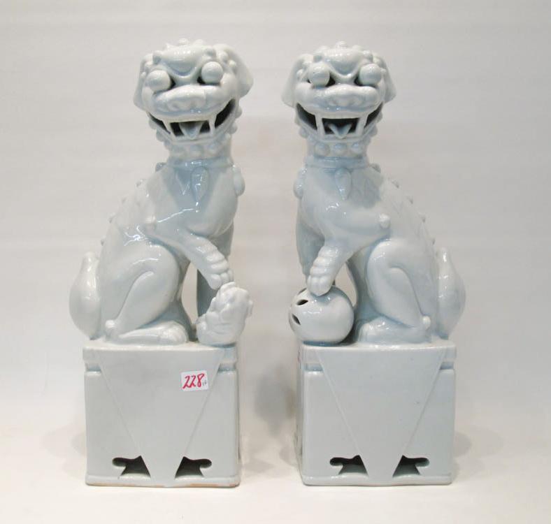 Appraisal: PAIR OF CHINESE BLANC DE CHINE PORCELAIN FOO-DOGS the seated