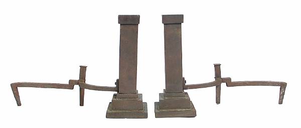 Appraisal: A pair of cast metal andirons height in width in