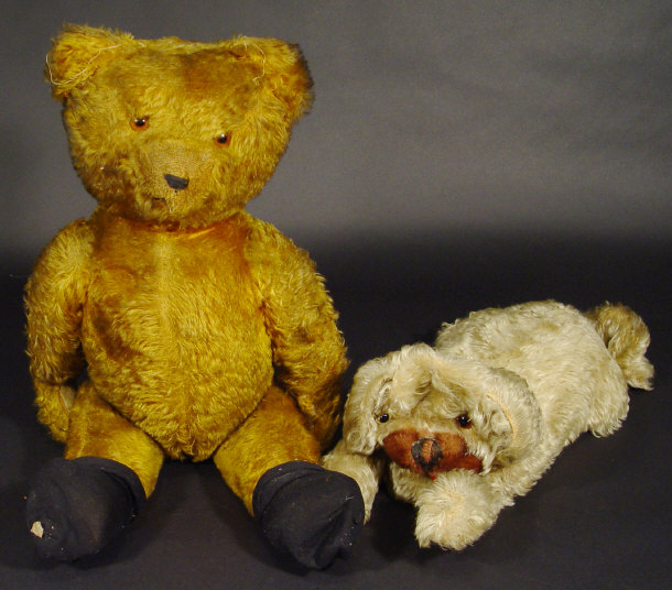 Appraisal: s golden straw filled teddy bear with jointed limbs and