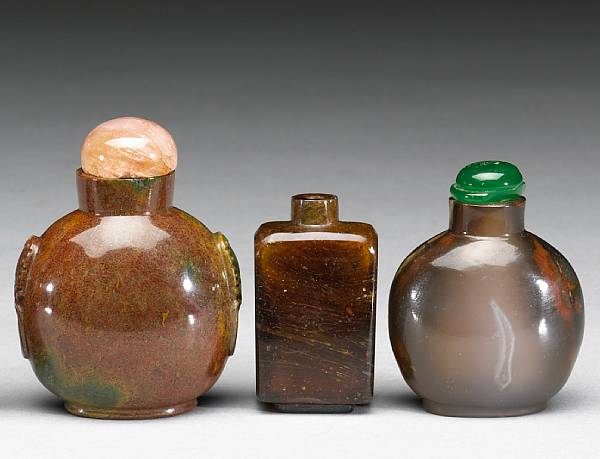 Appraisal: Three hardstone and glass snuff bottles The first of glass