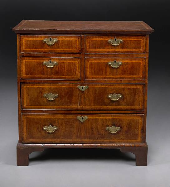 Appraisal: A George II featherbanded walnut chest of drawers second quarter