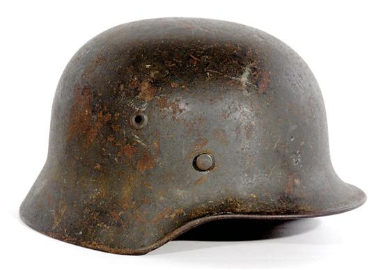 Appraisal: German WWII M combat helmet complete with liner and chinstrap