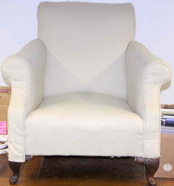 Appraisal: A Victorian upholstered armchair on turned front legs