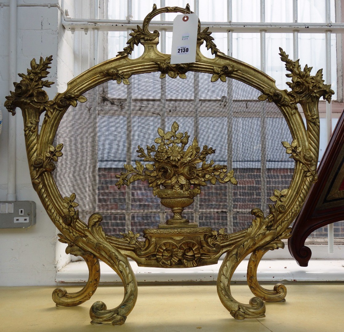 Appraisal: A French gilt bronze fire screen of Louis XV style