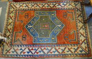 Appraisal: A Turkish rug geometric design on blue crimson ground cm