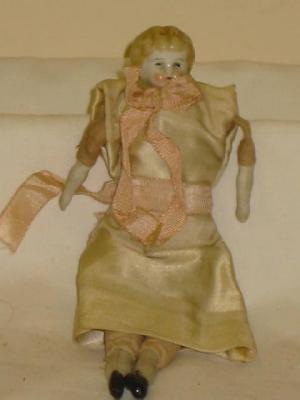 Appraisal: A china shoulder head doll's house doll with painted face