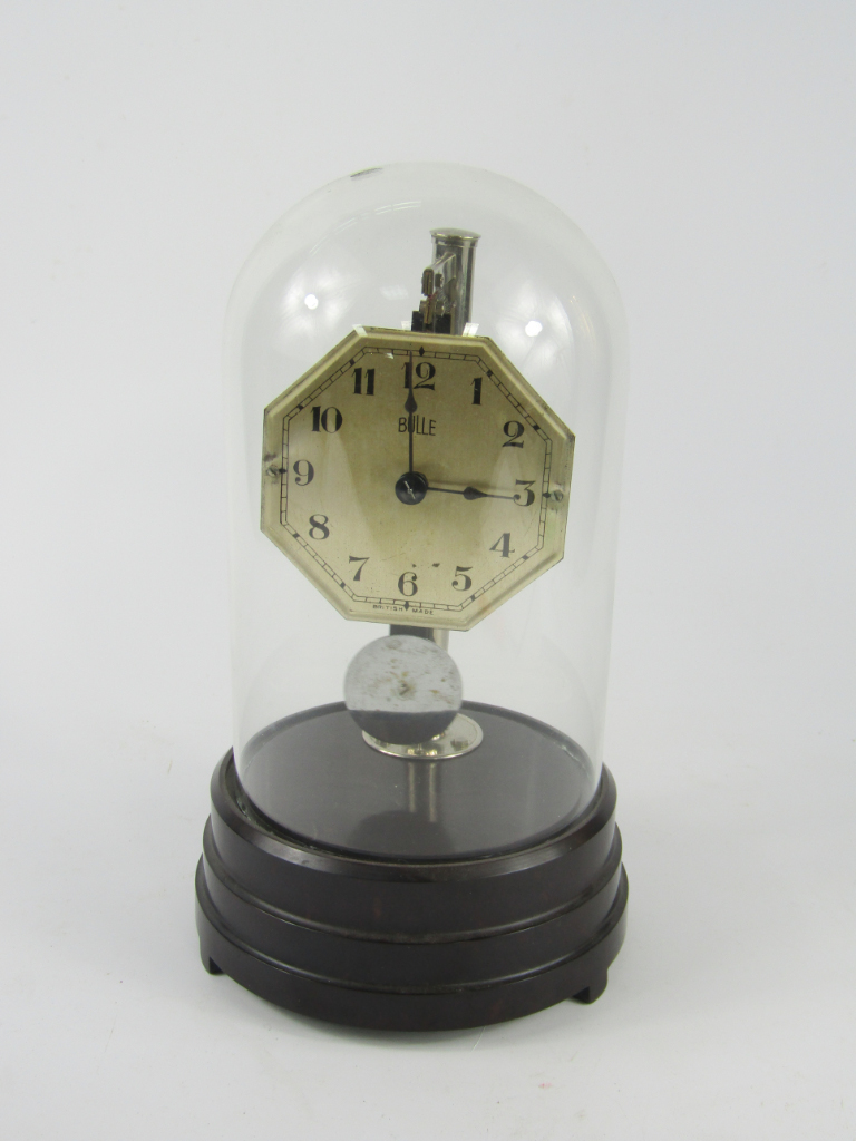 Appraisal: A Bulle battery operated clock octagonal dial bearing Arabic numerals