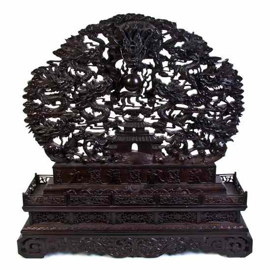 Appraisal: A Chinese Pierced Wood Table Screen of circular form having