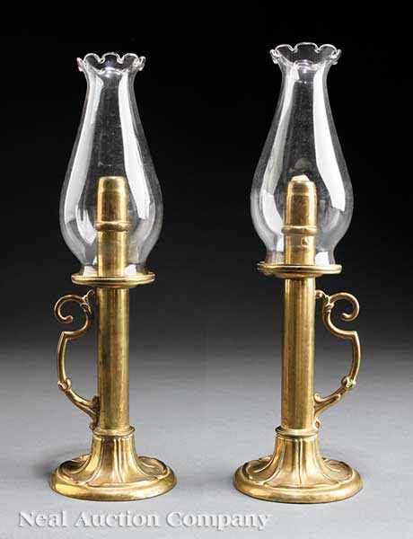 Appraisal: A Pair of American or English Brass Spring-Loaded Candlesticks th