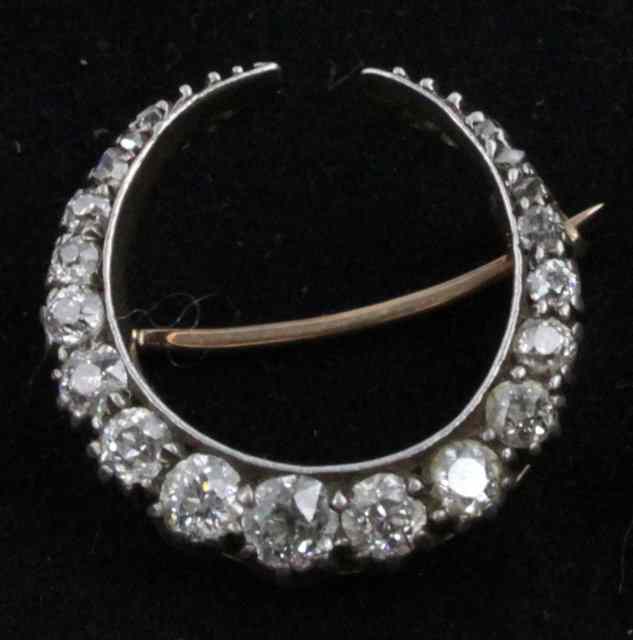 Appraisal: An early th Century diamond crescent brooch set in gold