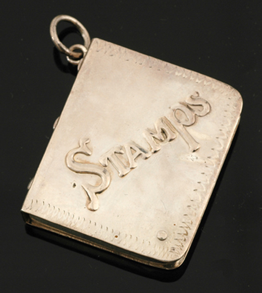 Appraisal: STERLING SILVER STAMP HOLDER PENDANT WITH ENGRAVED DECORATION