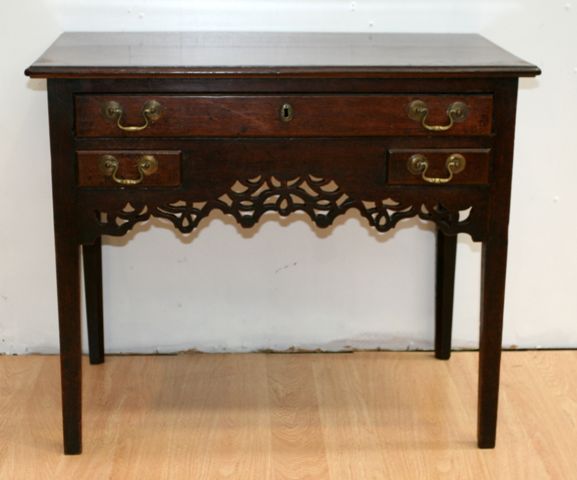 Appraisal: A George III oak side table restorations cm wide cm