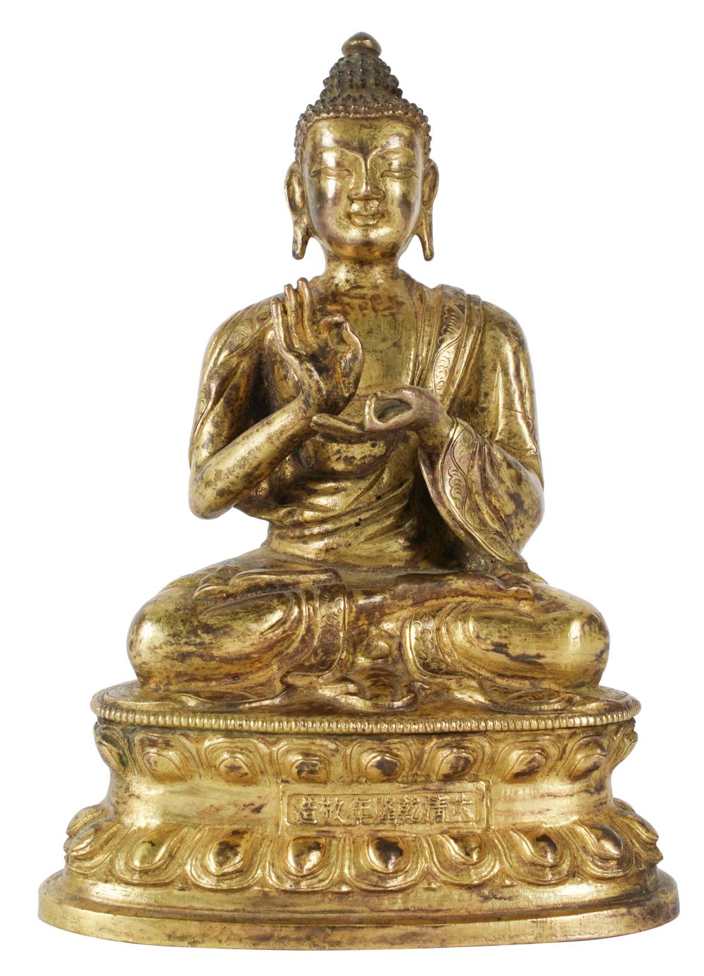 Appraisal: CHINESE GILT METAL BUDDHA FIGUREstamped motif to underside inches wide