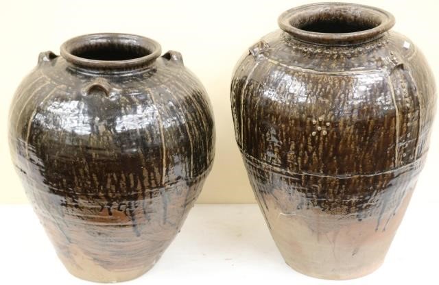 Appraisal: TWO MARTAVAN GLAZED POTTERY STORAGE JARS OVOIDFORM DARK BROWN GLAZE