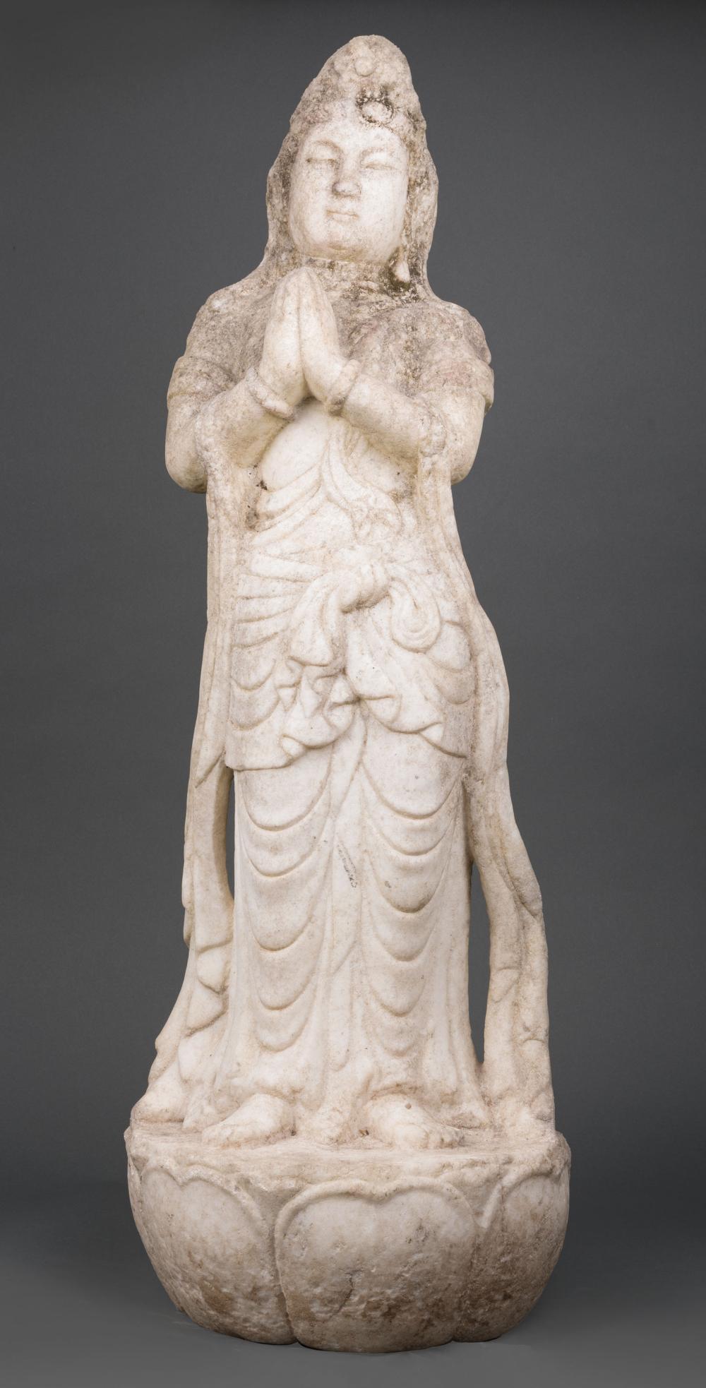 Appraisal: Chinese Marble Figure of Guanyin carved standing on a lotus