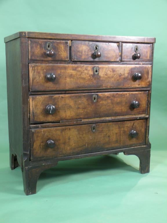 Appraisal: A mid thC walnut and chevron banded chest of drawers