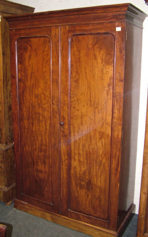 Appraisal: A late Victorian mahogany wardrobe the moulded cornice above two