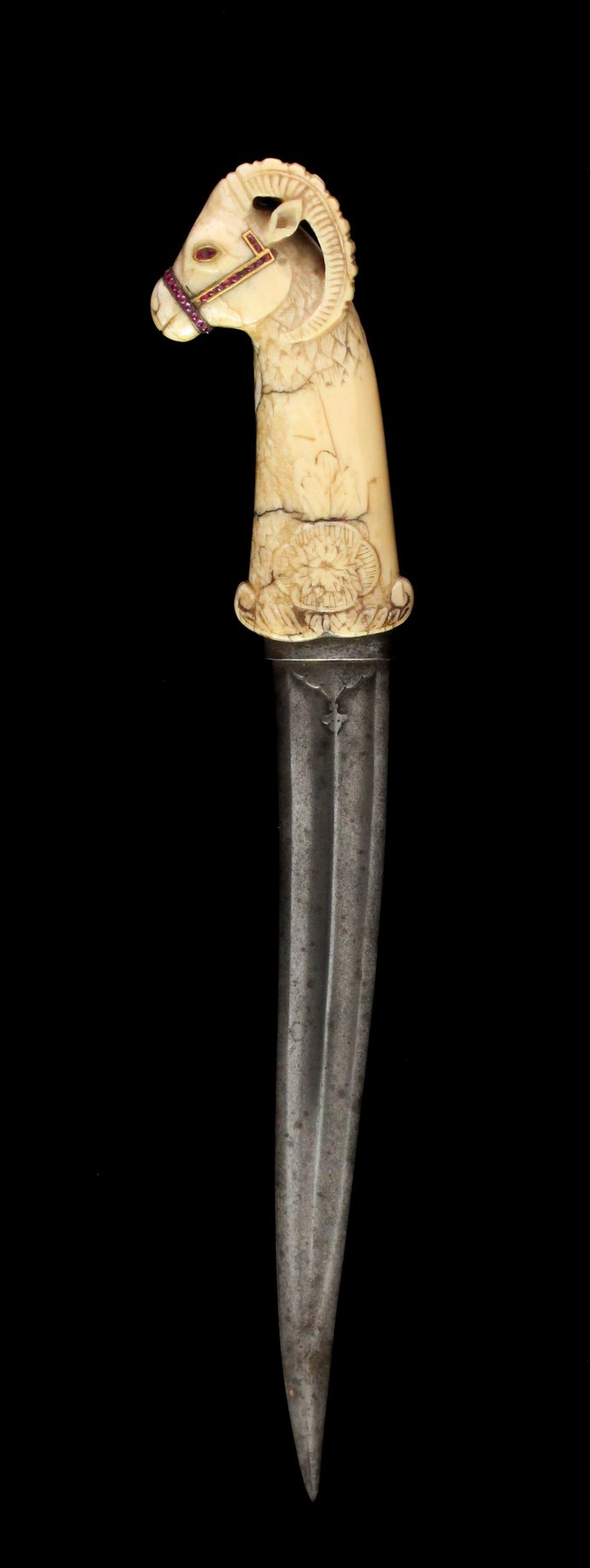 Appraisal: A Mughal dagger with ram's head handle in ivory inlaid