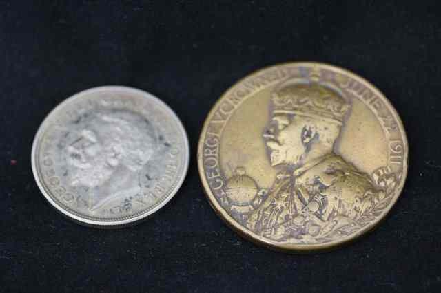 Appraisal: A GEORGE V SILVER WREATH CROWN and a Coronation Medal