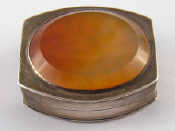 Appraisal: A silver vinaigrette rectangular with curved sides and inset cornelian