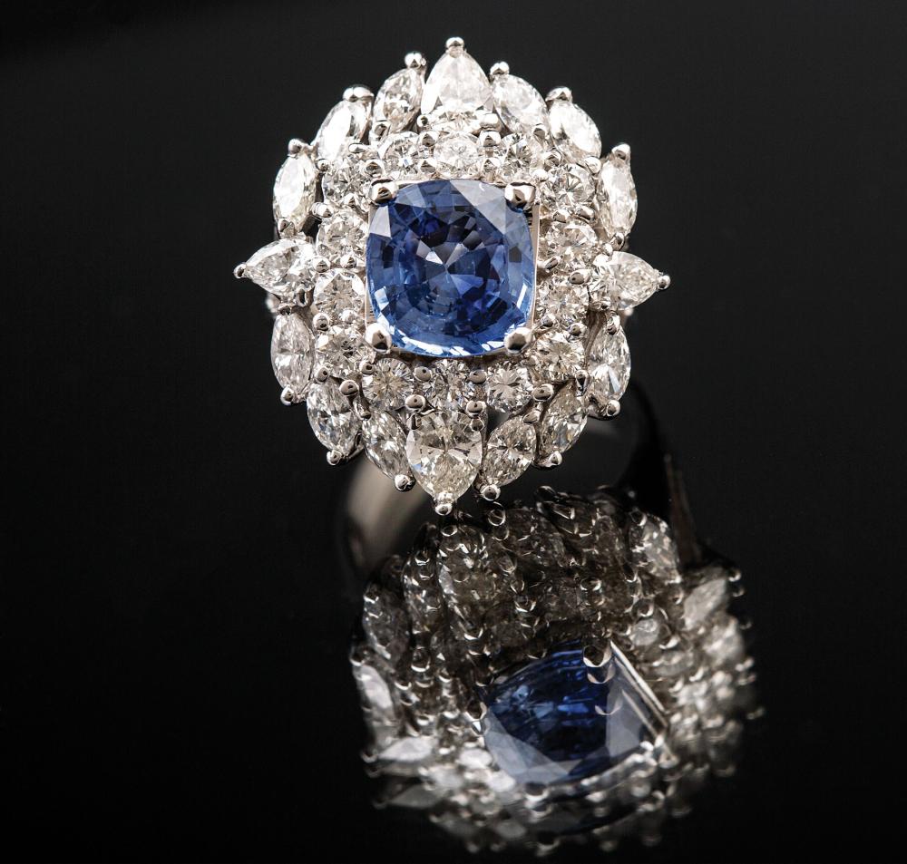 Appraisal: kt White Gold Sapphire and Diamond Cluster Ring faceted sapphire