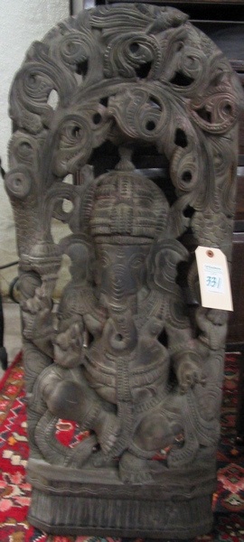 Appraisal: AN EAST INDIAN WOOD SCULPTURE Ganesha the elephant god the