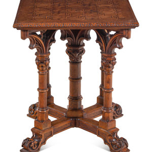 Appraisal: A Gothic Revival Walnut and Oak Parquetry Center Table by