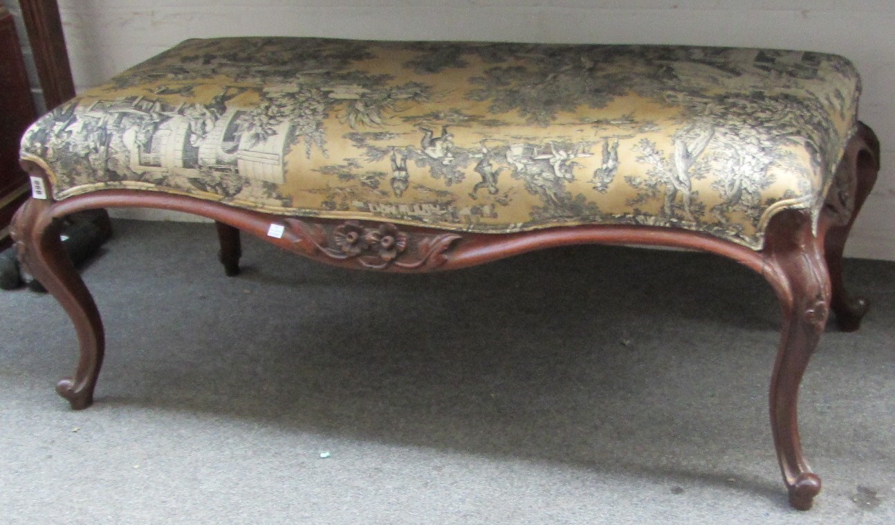 Appraisal: A large Victorian walnut framed footstool with rectangular top and