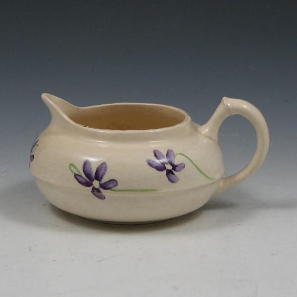 Appraisal: Early Taft or Hampshire Pottery hand decorated creamer with violets