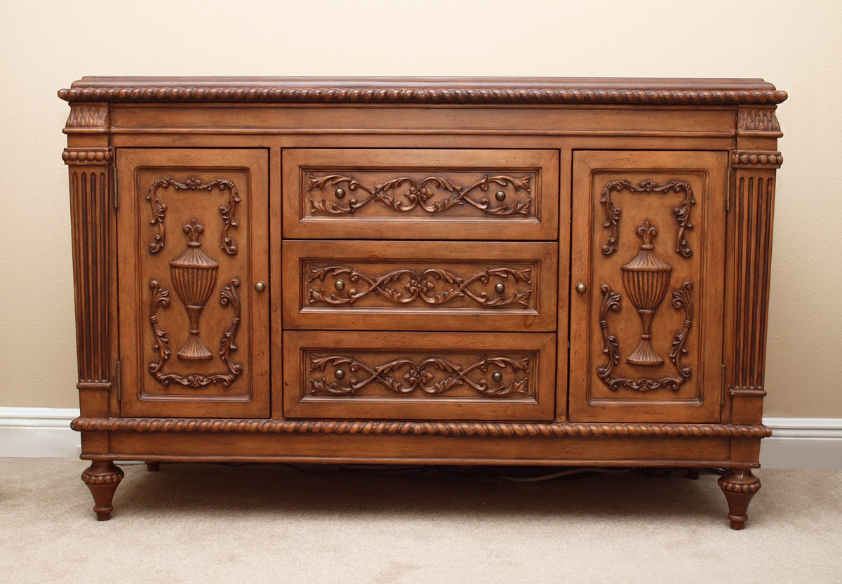 Appraisal: MODERN DECORATOR SIDEBOARD drawers flanked by doors applique carvings leathered