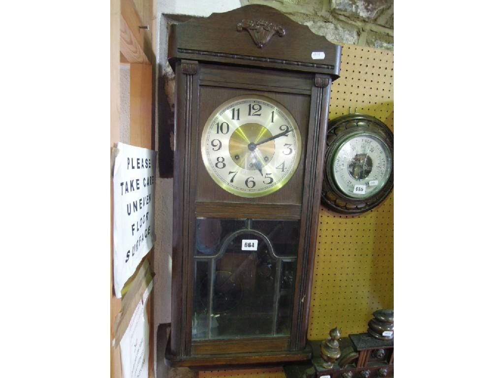 Appraisal: An early th century oak cased wall clock with three