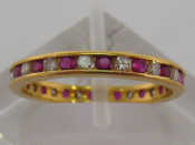 Appraisal: A ruby and diamond eternity ring alternately set with brilliants