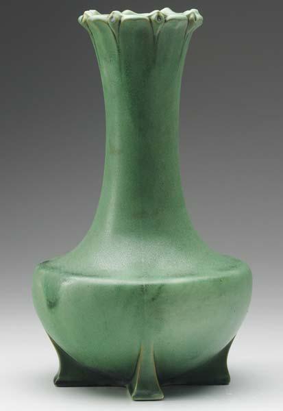 Appraisal: TECO Bottle-shaped vase with floriform rim on four feet covered