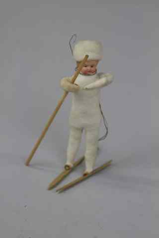 Appraisal: CHILD ON SKIS Early pressed spun cotton child on skis