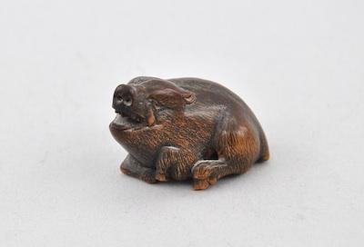 Appraisal: Recumbent Warthog Okimono Carved wood warthog with dark patina singed