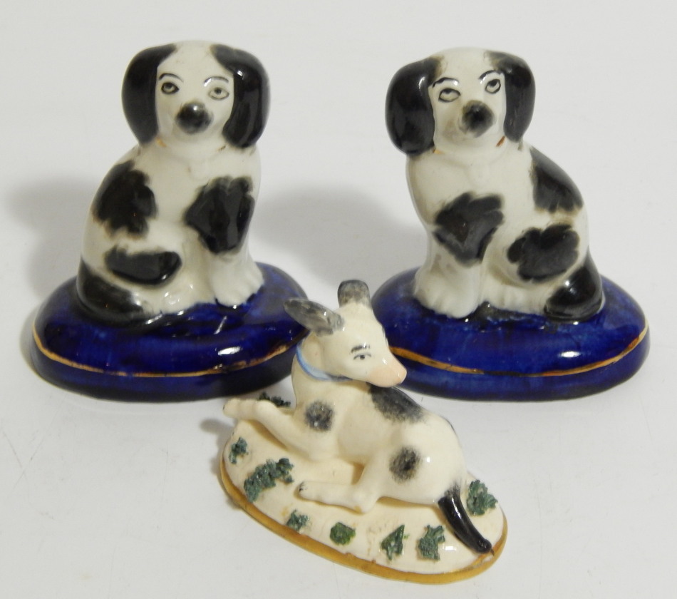 Appraisal: A thC porcelain figure of a seated hound with gold