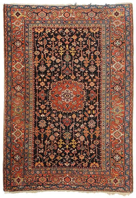 Appraisal: Heriz Rug black field with oval central medalion rust blues